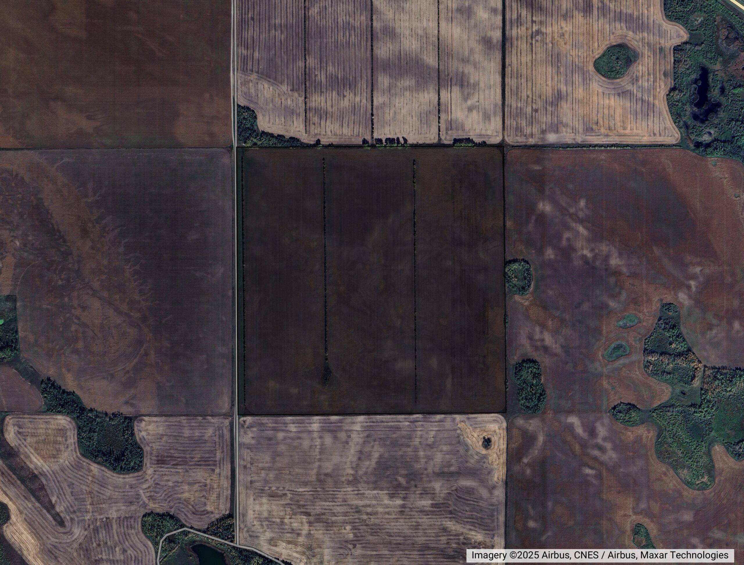 Aerial farmland view showing field boundaries and access